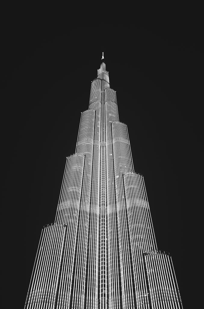 Low Angle View of Skyscraper Against Sky at Night